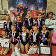 2018 National Codebreakers Gymnastic showing off their medals