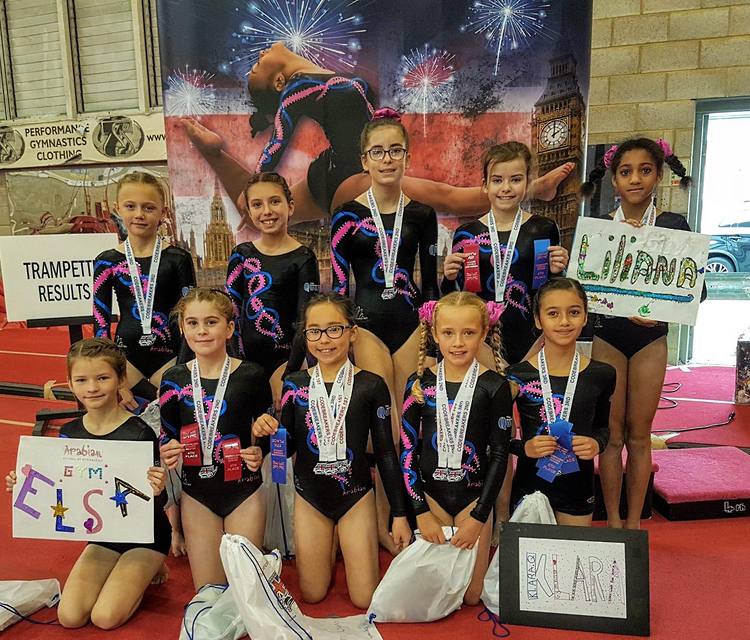 2018 National Codebreakers Gymnastic showing off their medals