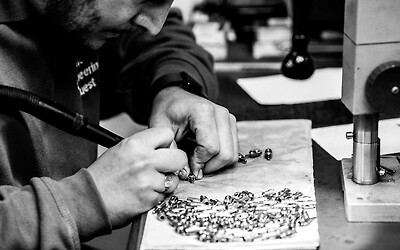 Hand de-burring parts in our Bench Cell at the Milton Keynes site, where the magic happens.